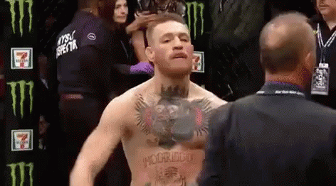 UFC fighter Conor McGregor confidently struts in the octagon