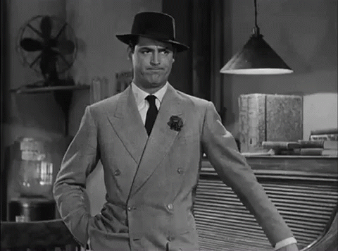 Cary Grant forcefully gesturing for someone to leave.