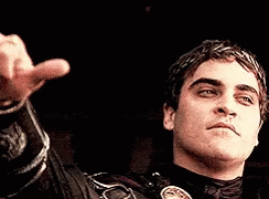 Emperor Commodus in the movie Gladiator showing his disapproval with a thumbs down gesture.