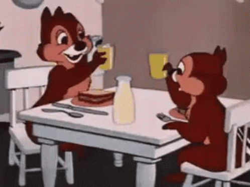 Two adorable squirrels raise their glasses in a toast to celebrate and congratulate.